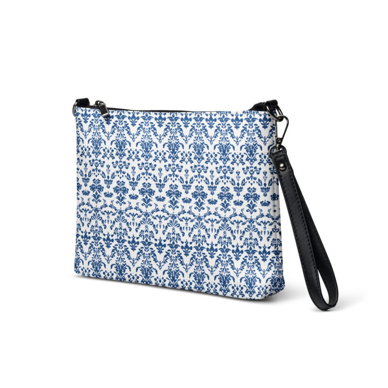 cross body bag for women. a bag with a blue floral print.