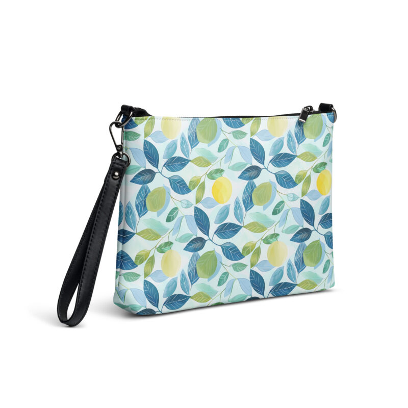 A cute crossbody bag with a lemon and leaves design